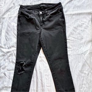Black distressed skinny jeans. Size 6.